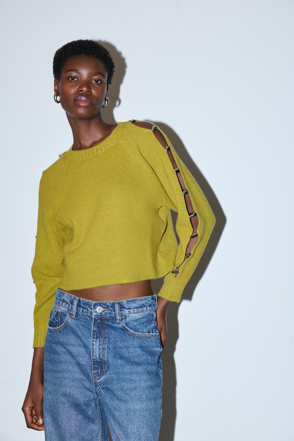 Camisola com apliques metálicos