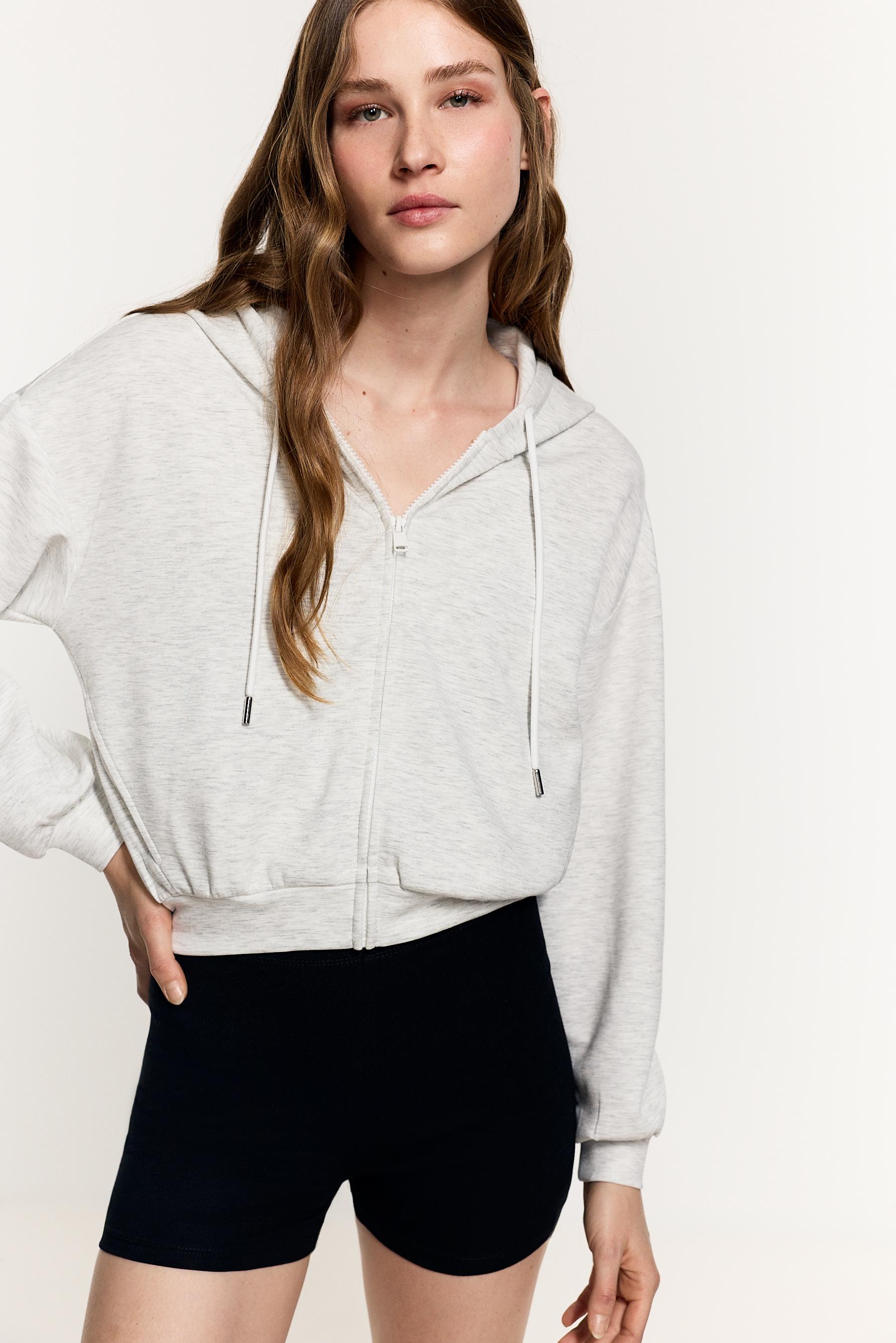 Sudadera cremallera fluida cuello capucha