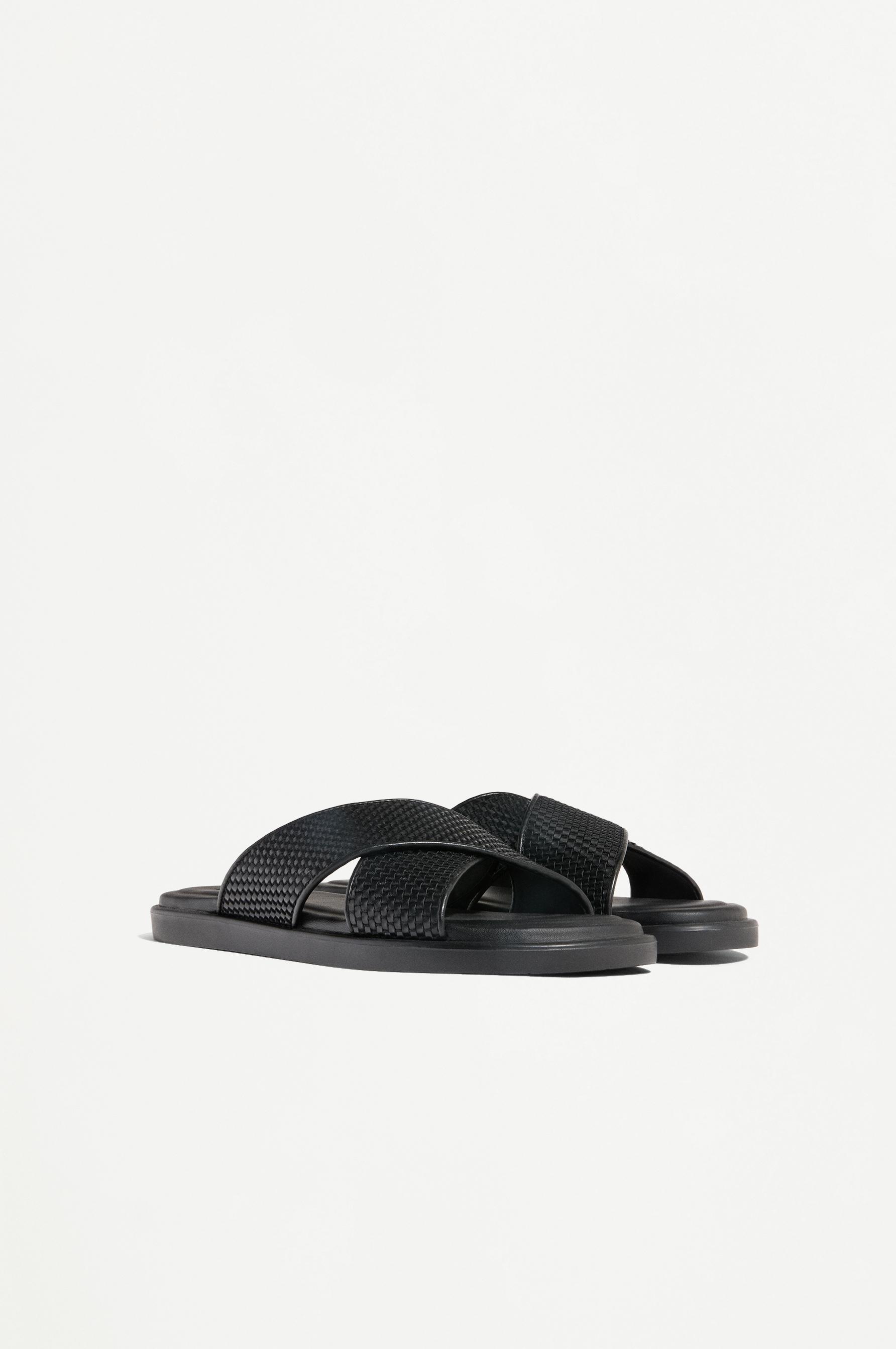 Crossed braided strap sandals — BLACK