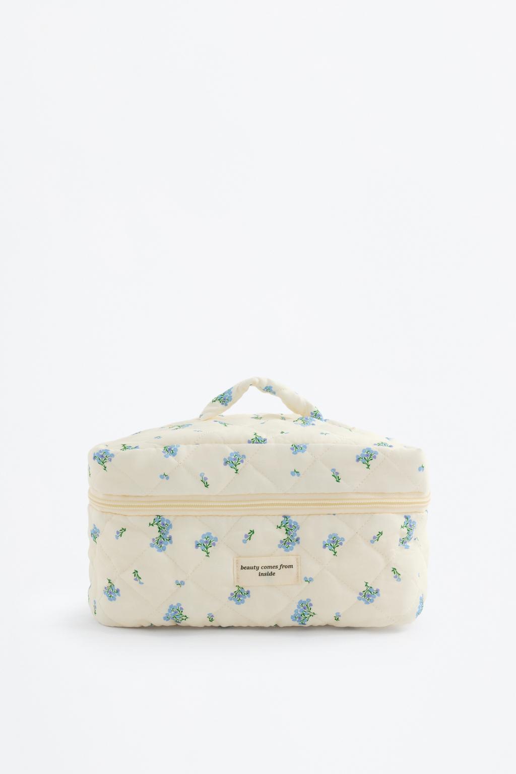 Quilted floral toiletry bag with handle
