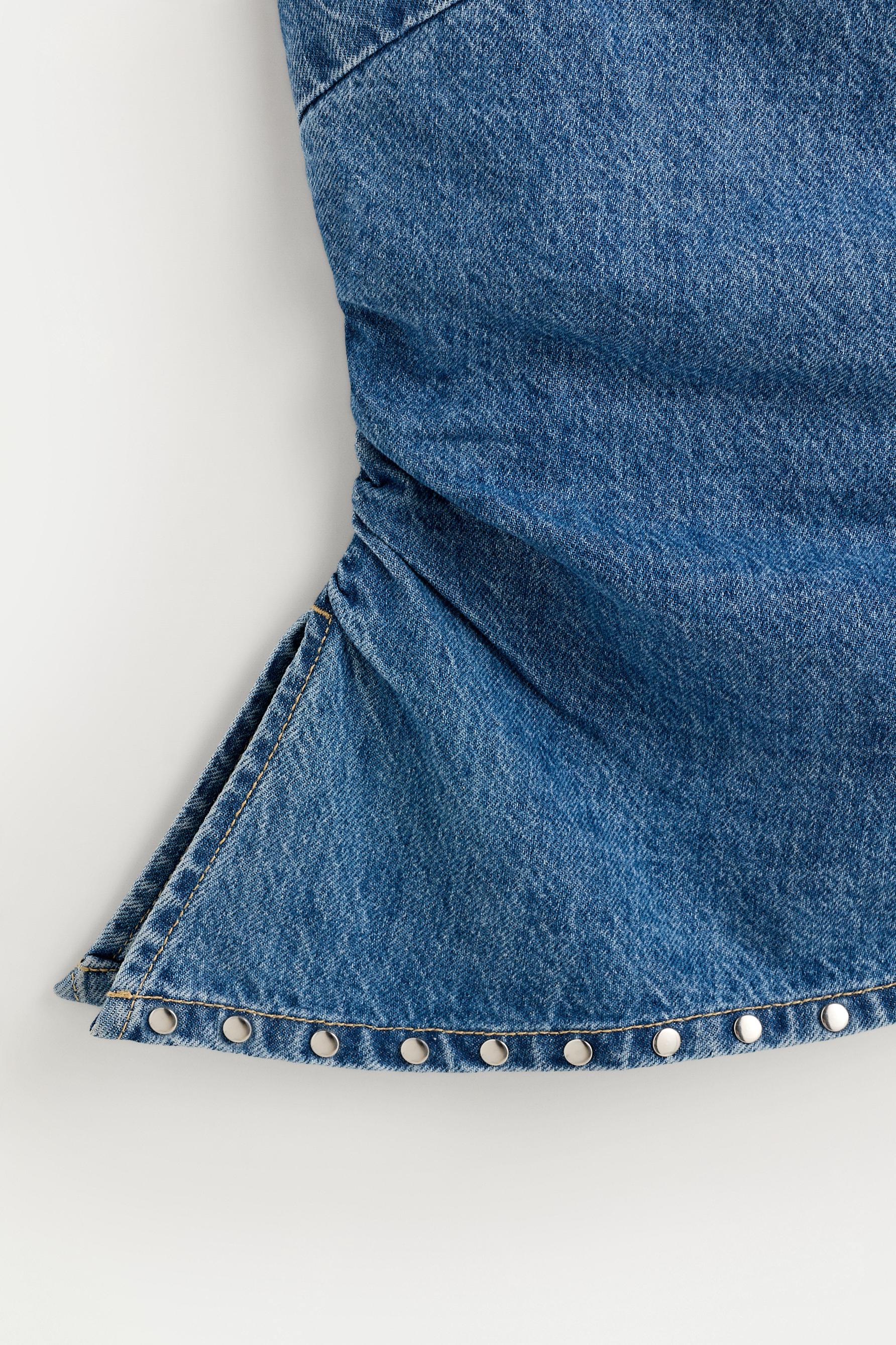 Asymmetric denim bandeau top with studs — PALE INDIGO