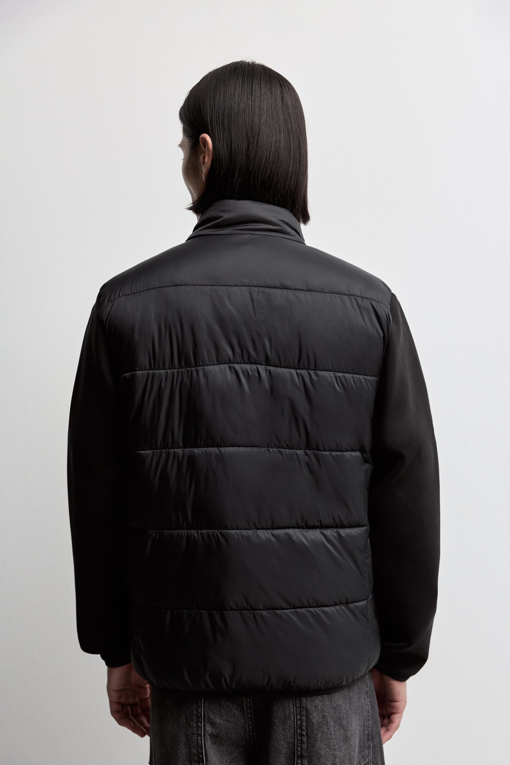 Quilted jacket with interlock sleeves — BLACK