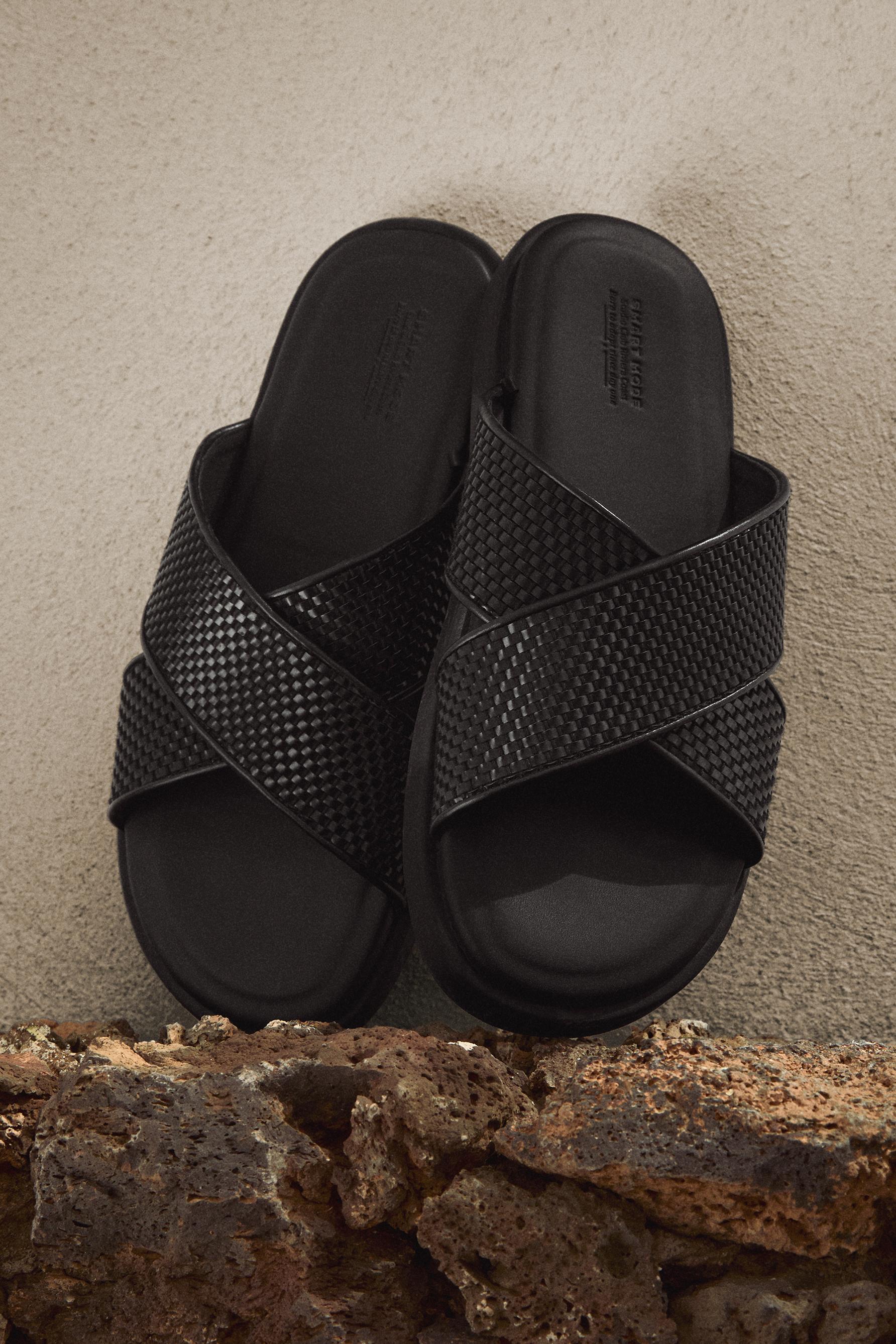 Crossed braided strap sandals — BLACK