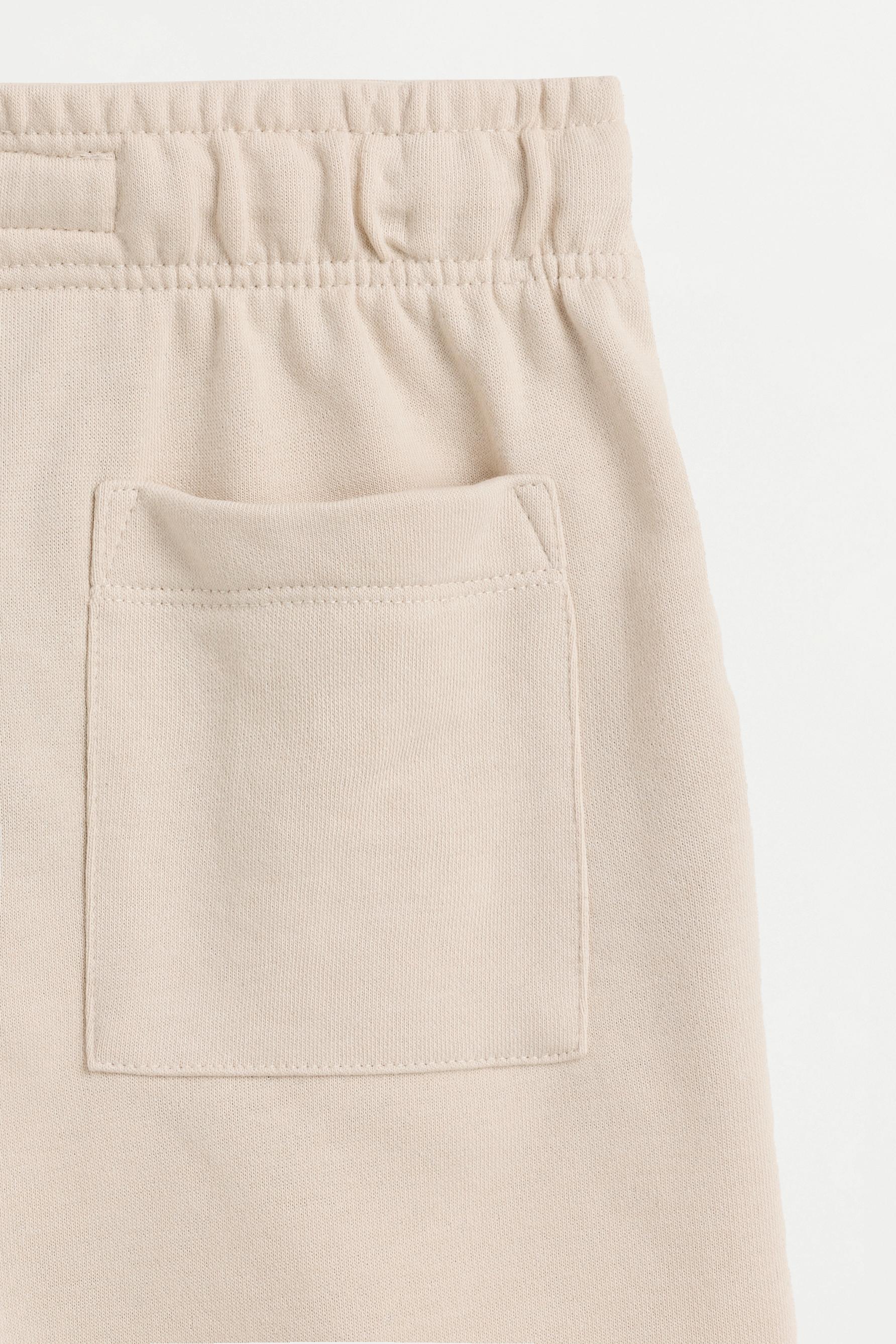 Jogger plush Bermuda shorts — PALE SAND