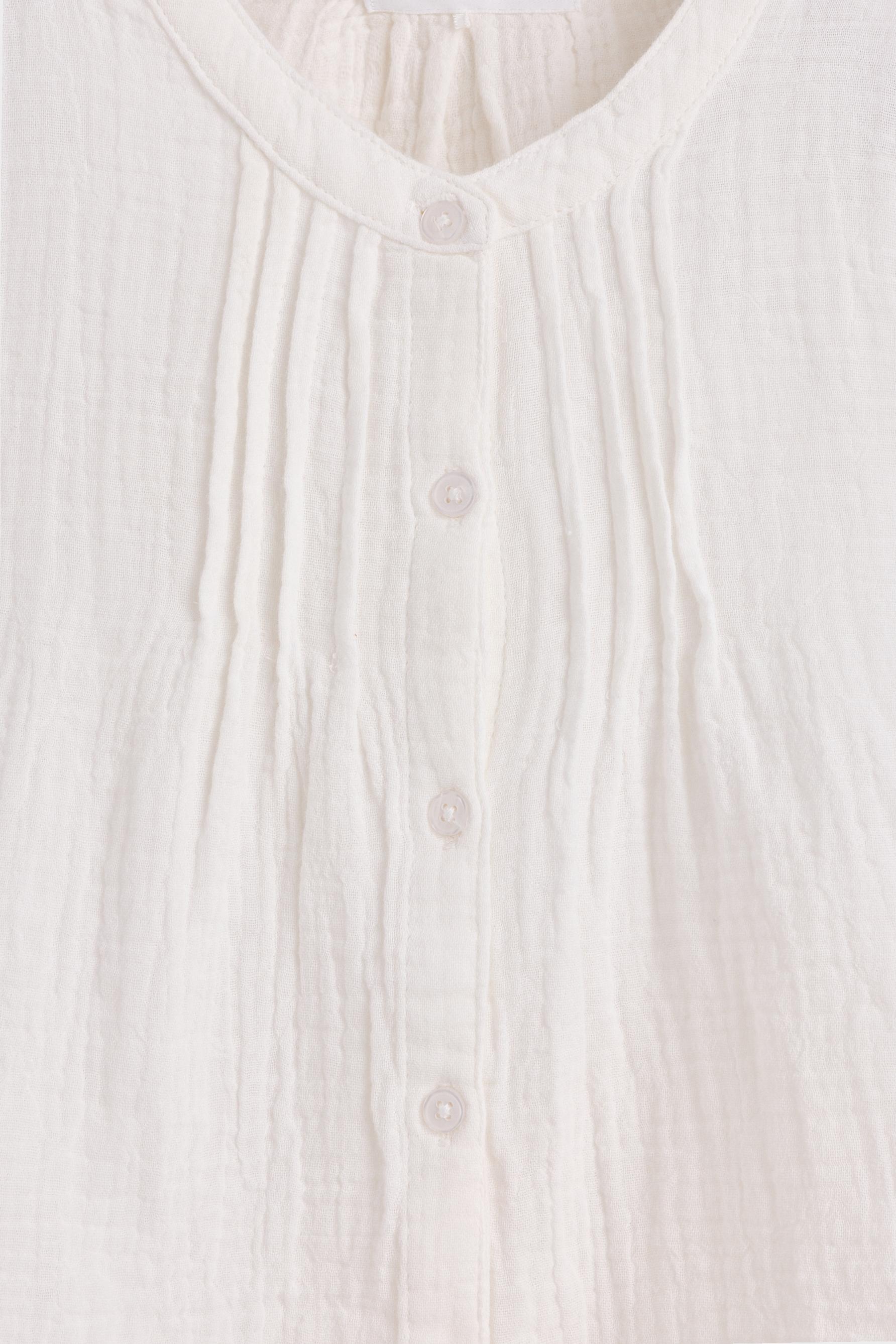 Double gauze ruffled blouse — OFF WHITE