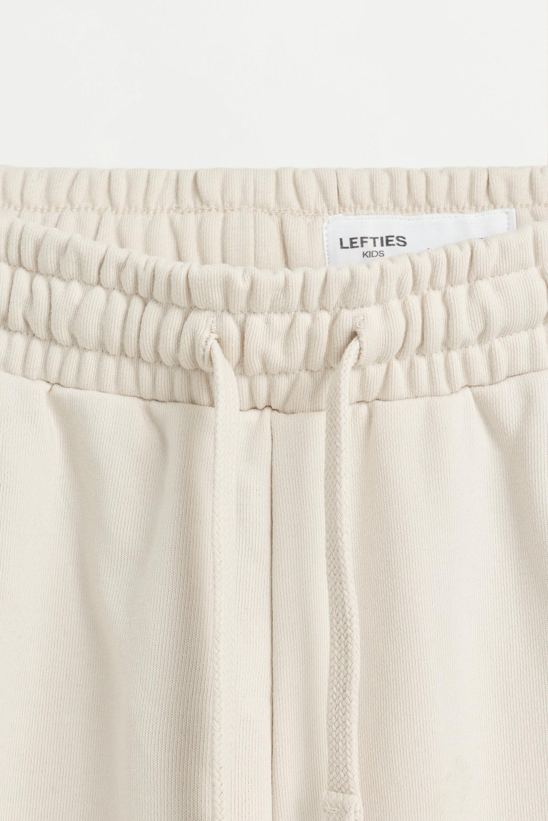 Plush Bermuda shorts with text — PALE MINK