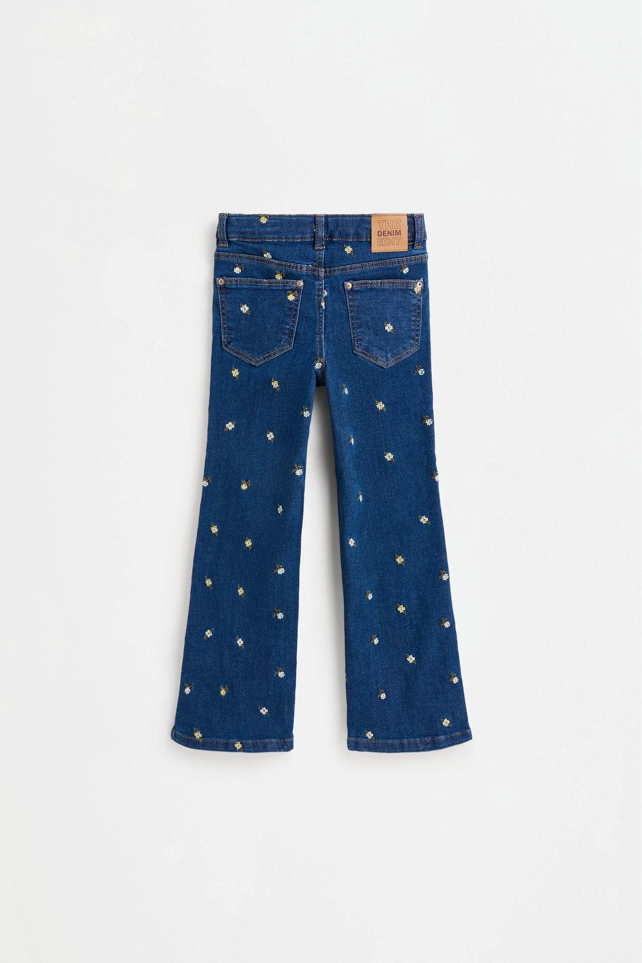 Floral embroidered bell bottom jeans — INDIGO