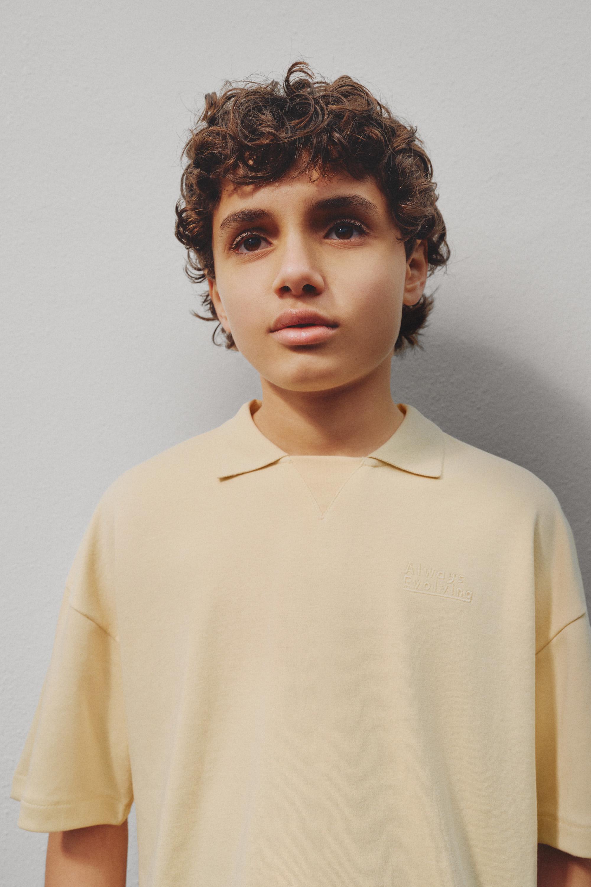 Interlock polo shirt with text — VANILLA