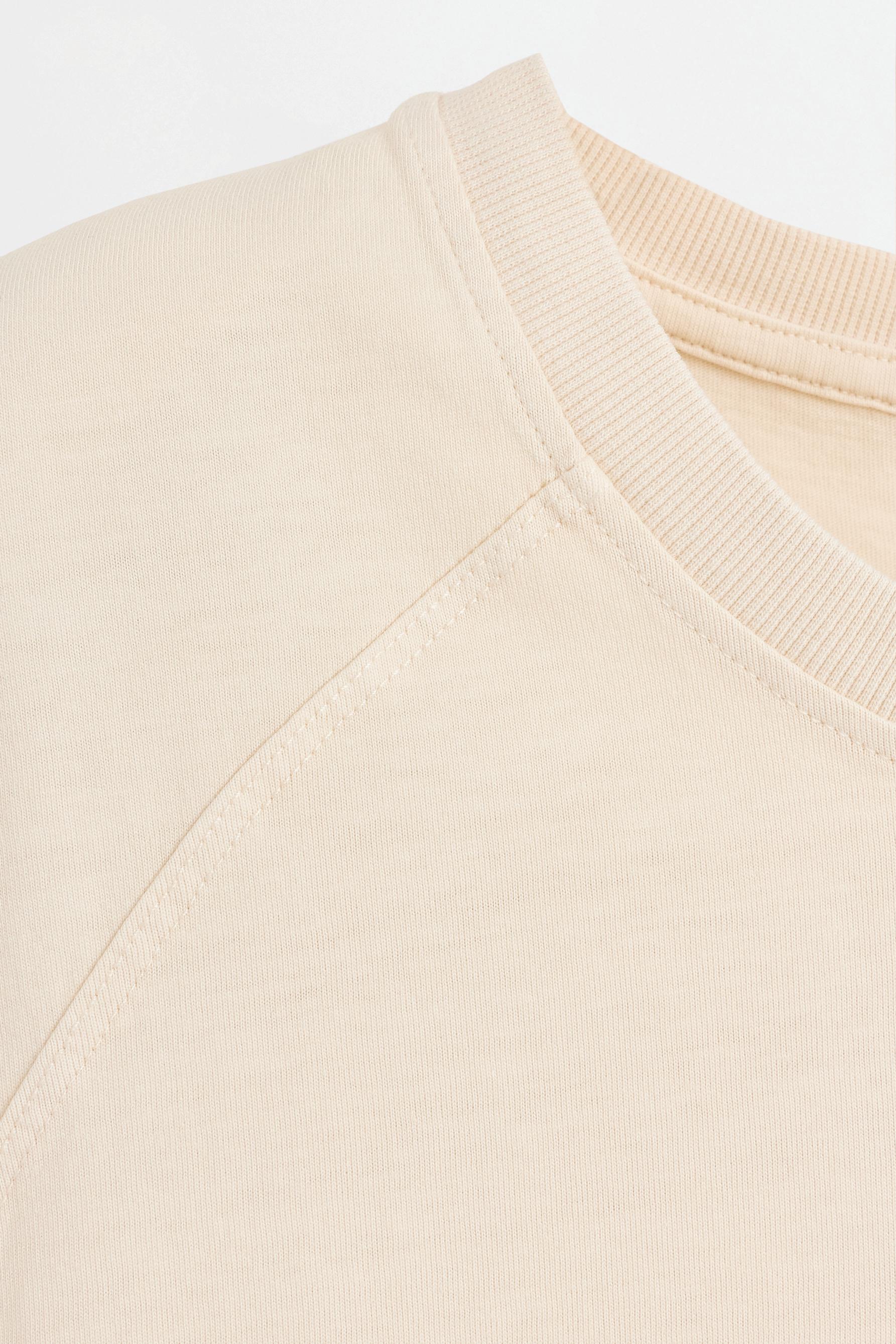 Washed-effect sleeveless T-shirt — ECRU