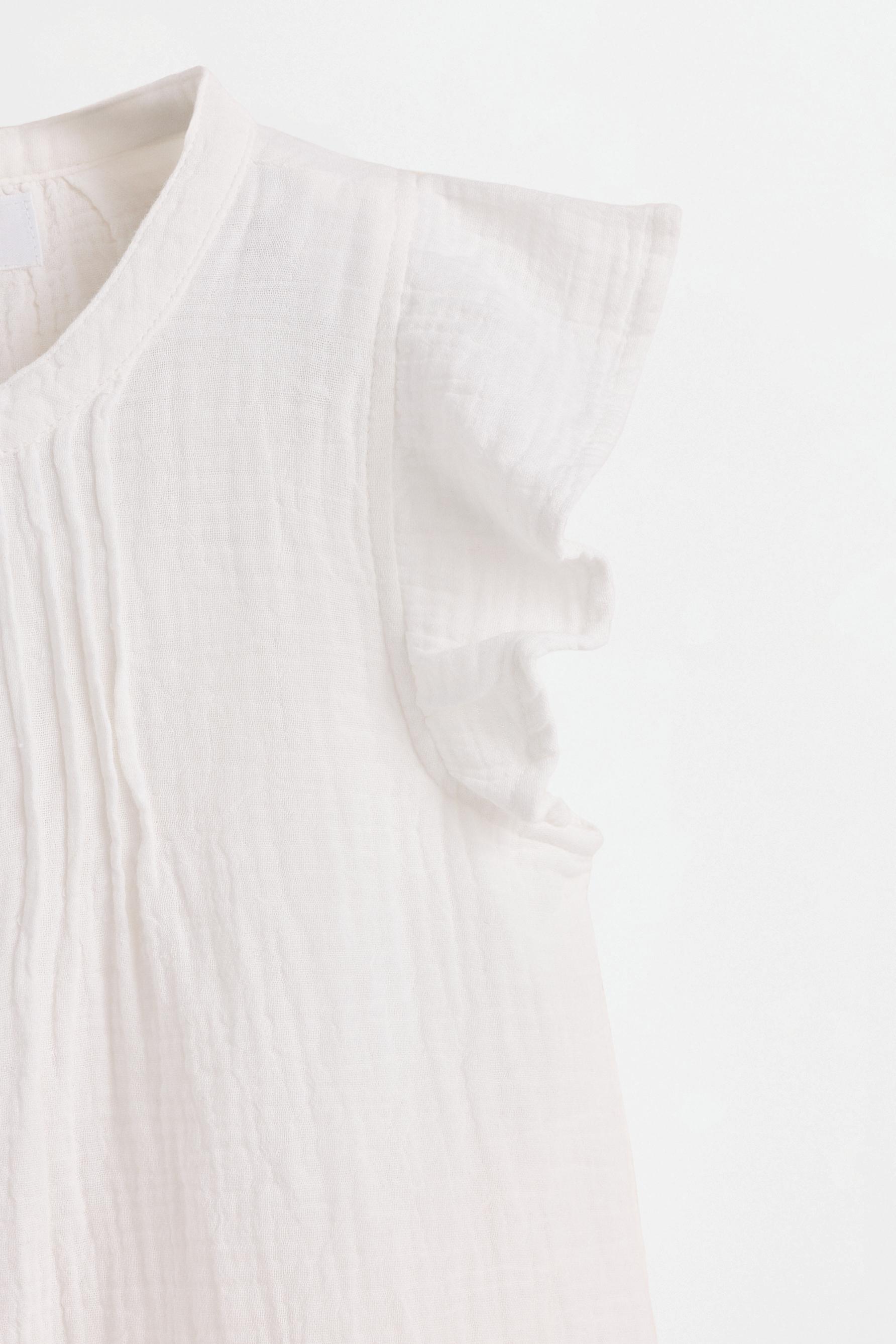 Double gauze ruffled blouse — OFF WHITE