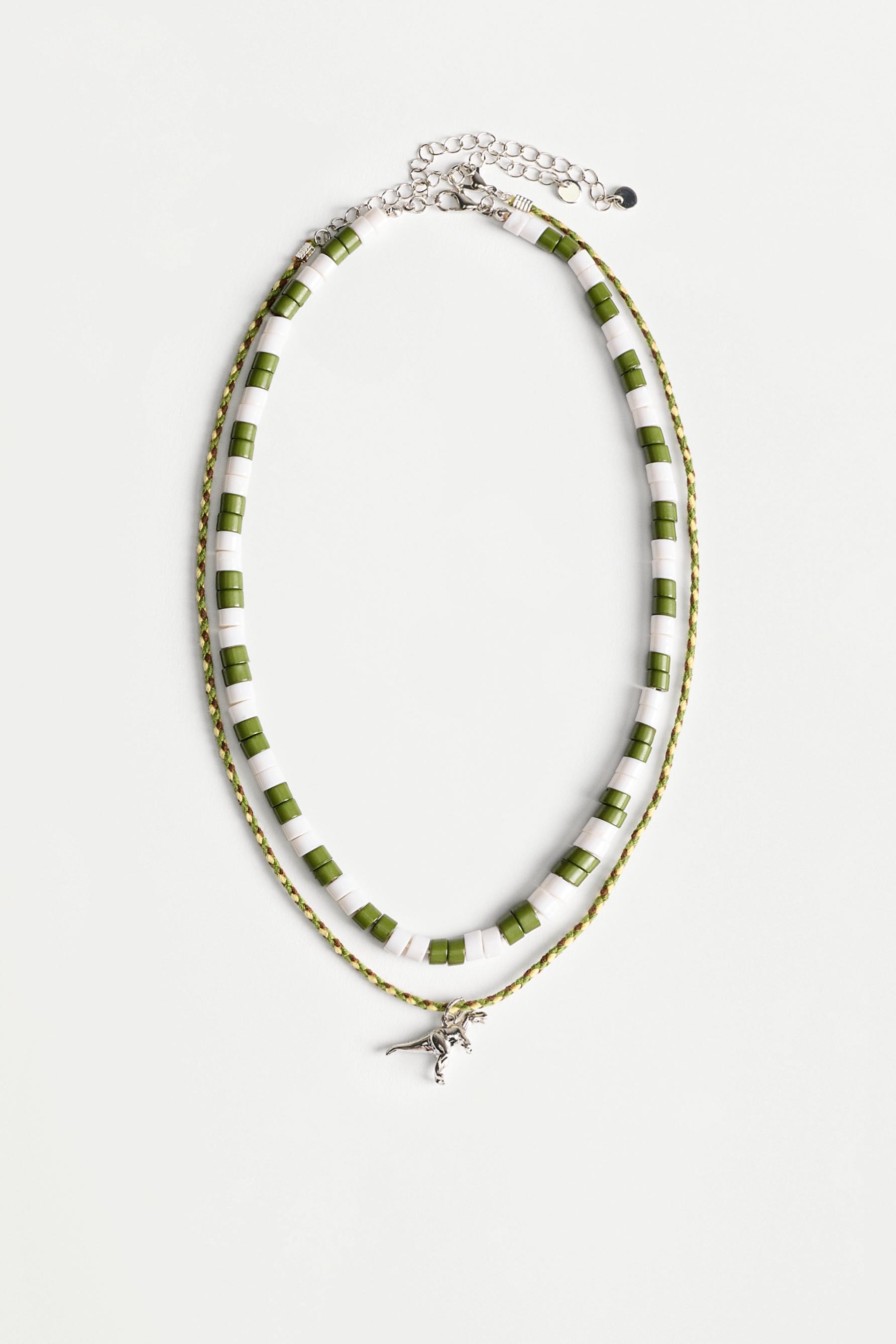 Double dinosaur necklace — VARIOUS