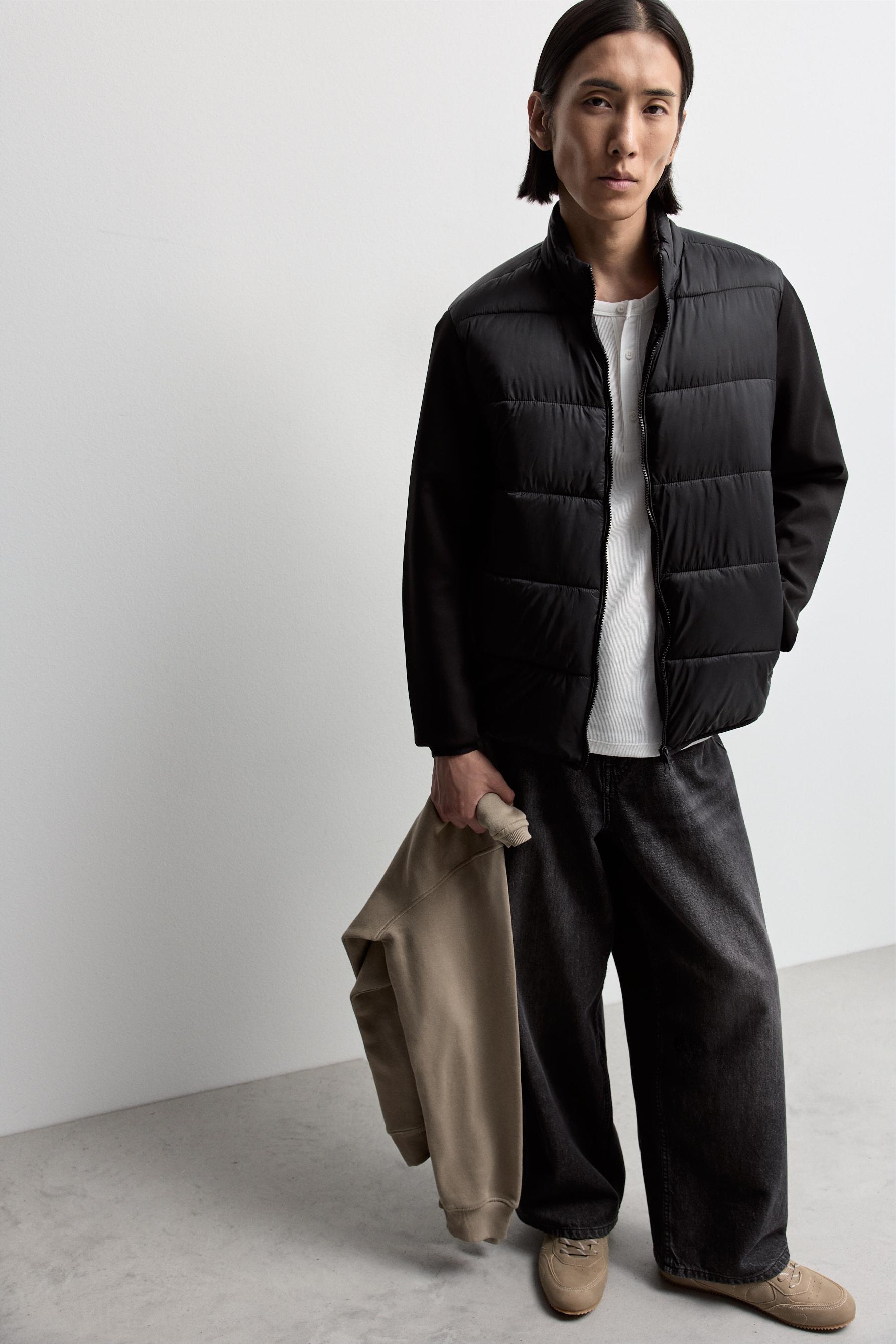 Quilted jacket with interlock sleeves — BLACK
