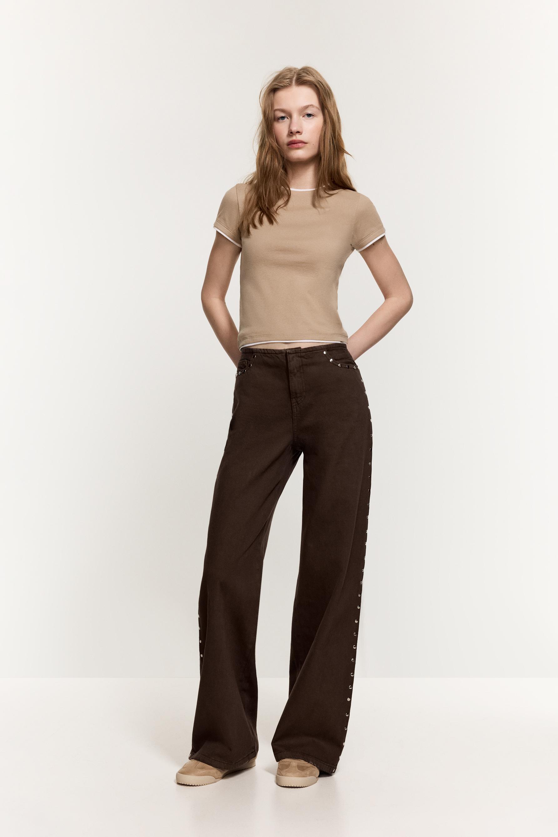 Jeans wide leg sin cintura tachas