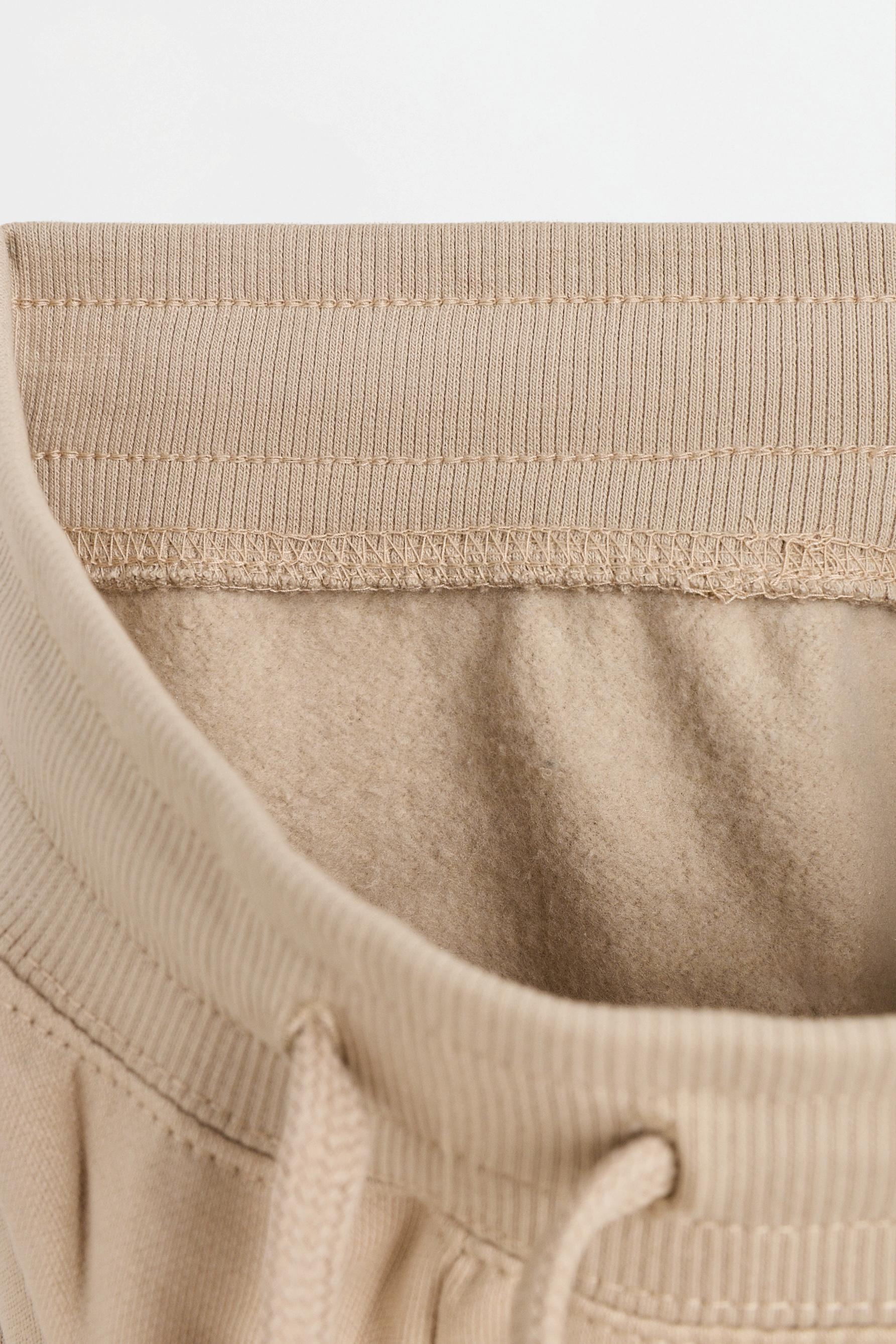 Plush trousers with knee stitching — SAND