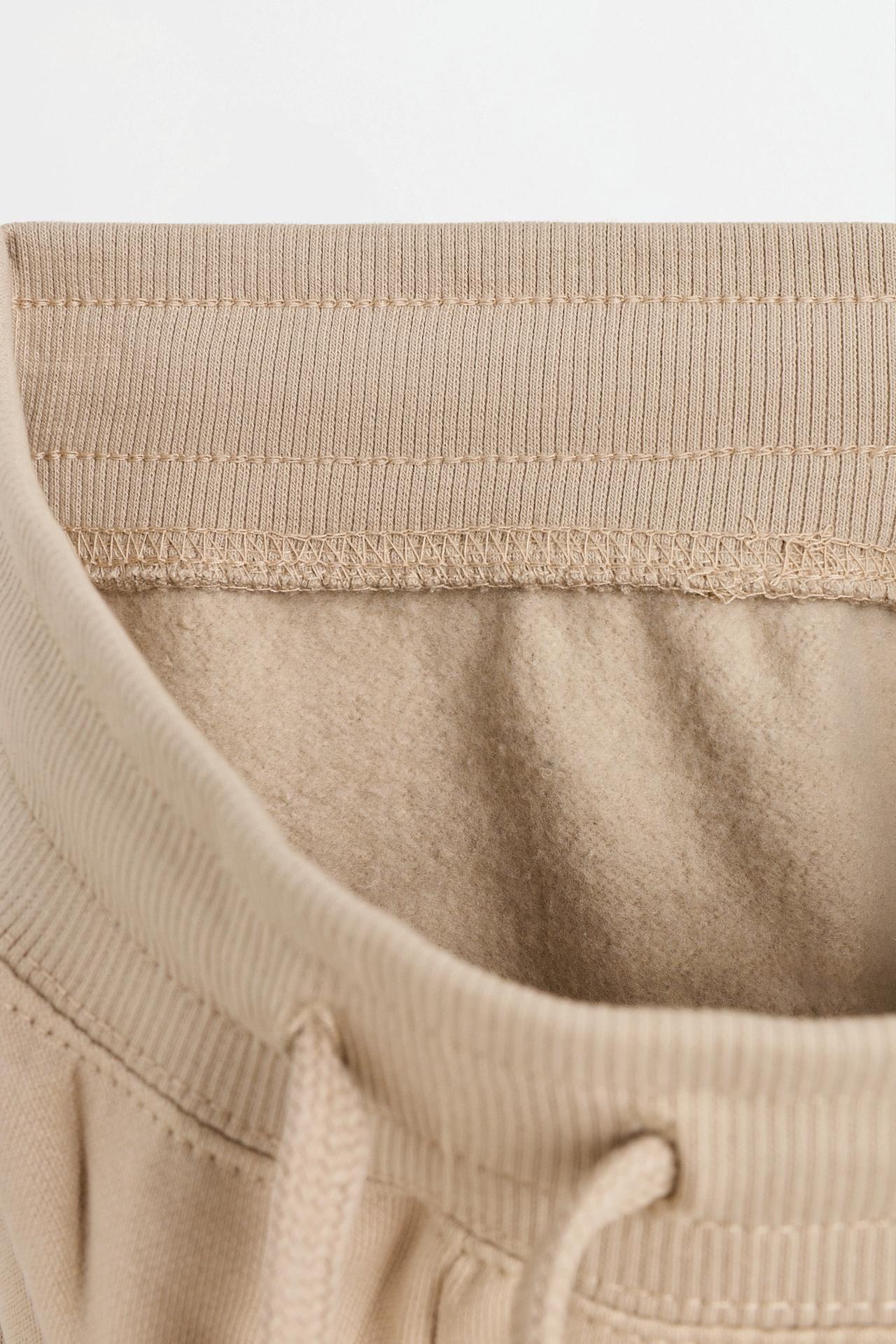Plush trousers with knee stitching — SAND