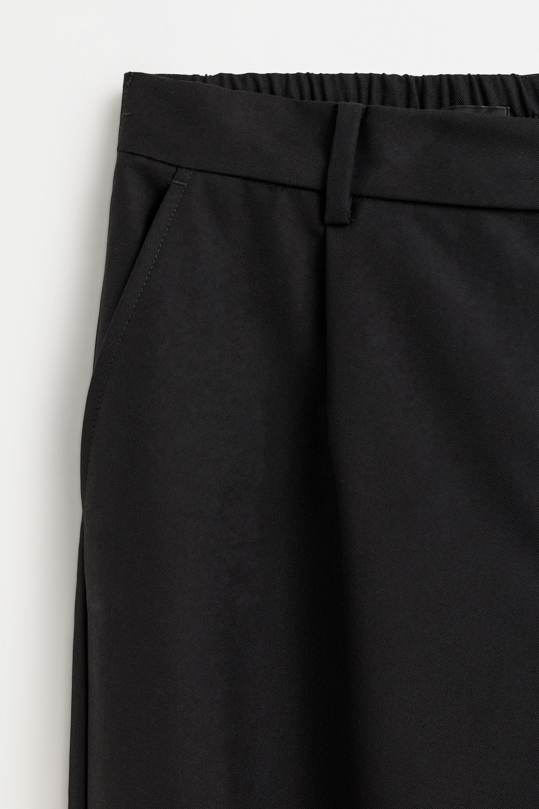 Baggy trousers with darts — BLACK