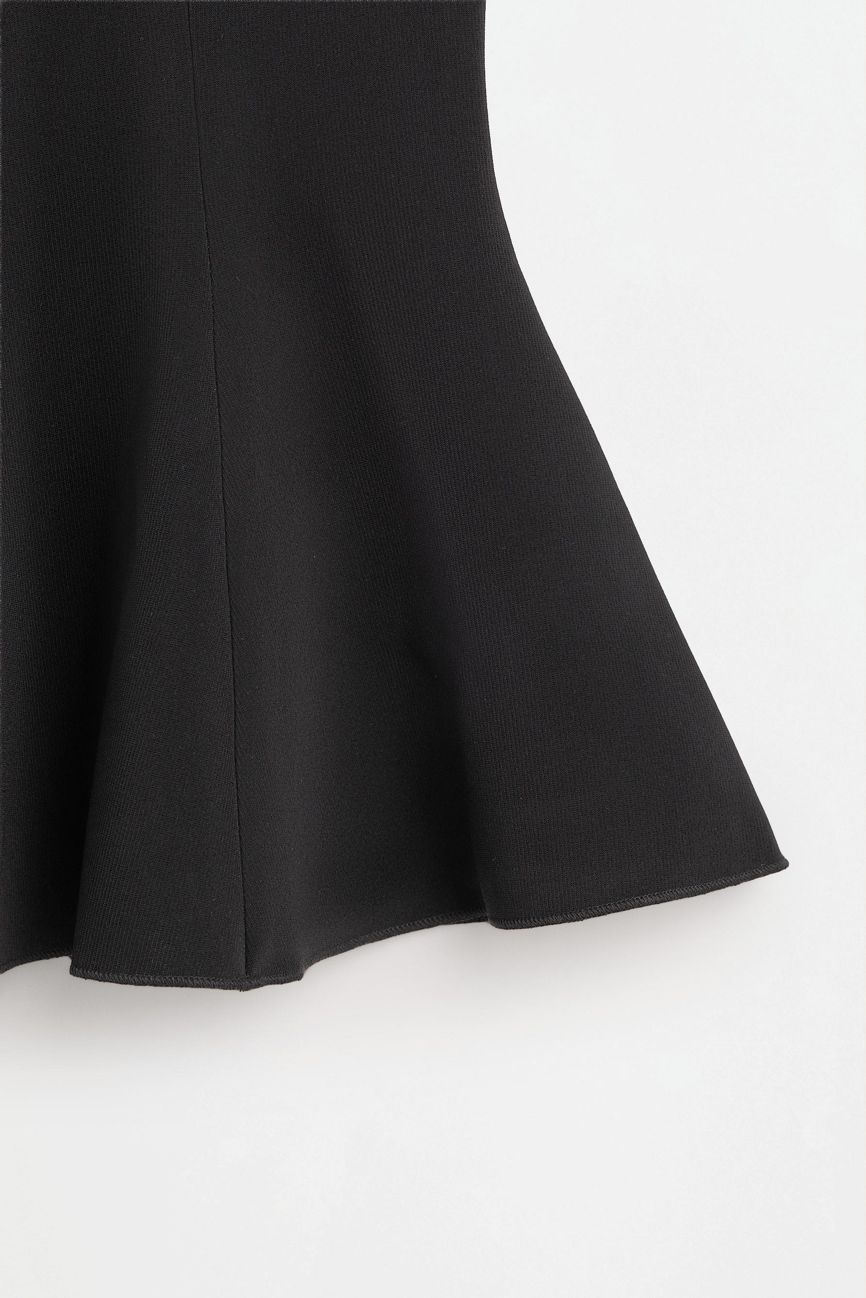 Peplum top — BLACK