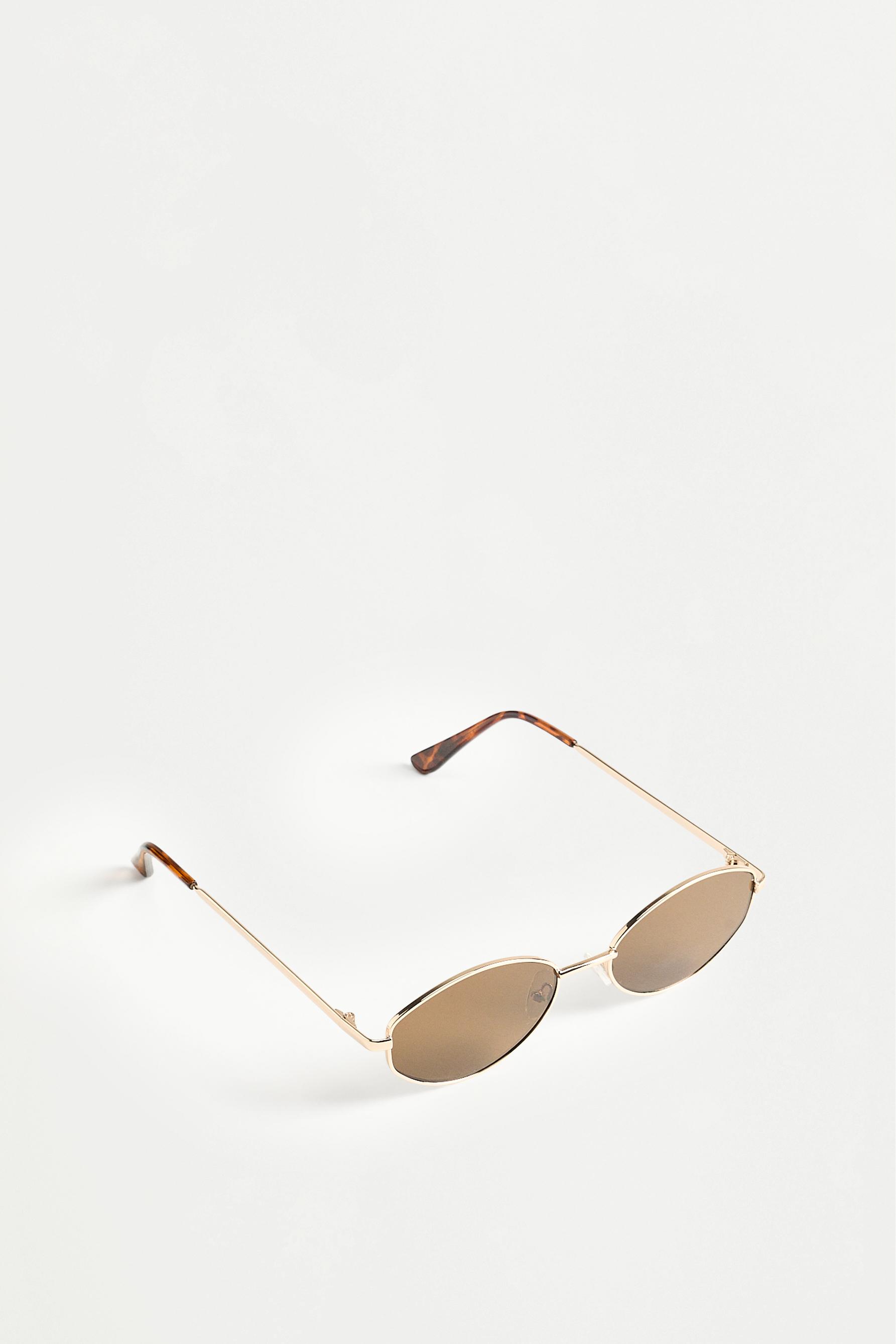 Irregular oval metallic sunglasses — GOLD