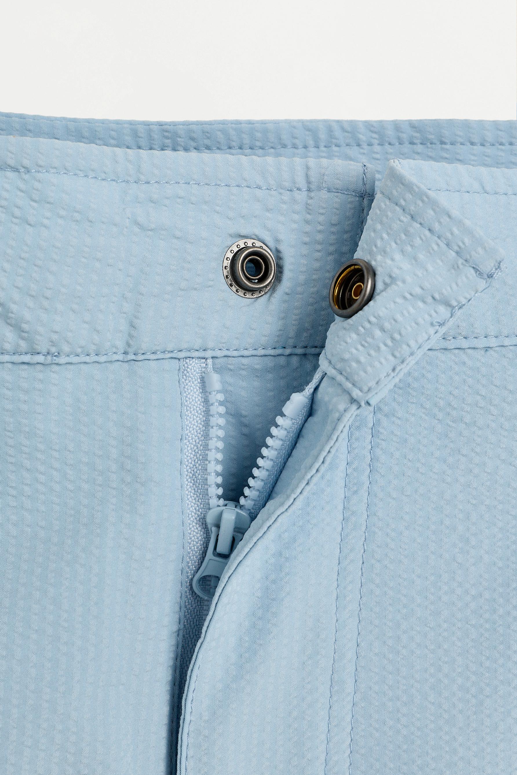 Short swim trunks with buckles — SKY BLUE