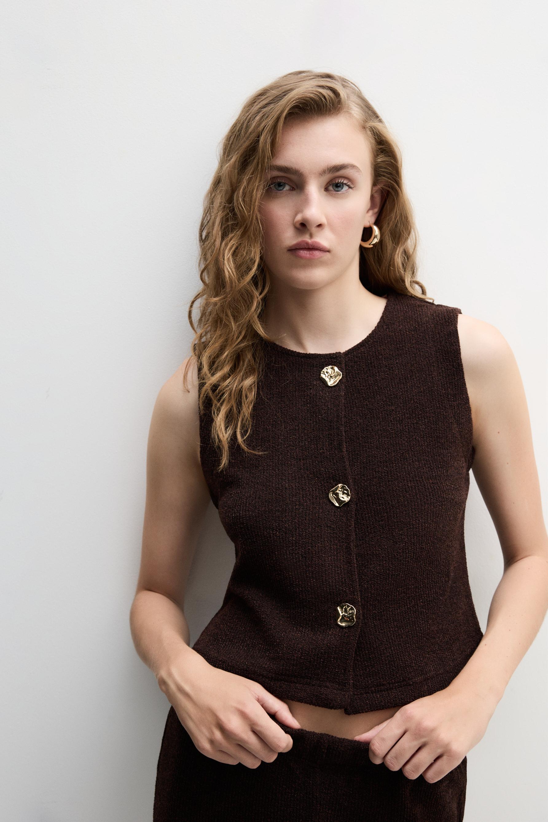 Chaleco botones metálicos